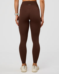 Woman wearing Elixir Ultra High-Rise Full Length Legging Pockets - Hot Chocolate | Model:Maja | Size:XS