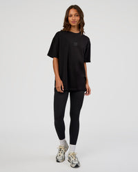 Woman wearing Everyday Elevation FLXCotton Oversized Tee - Black-Black | Model:Dakota | Size:XS