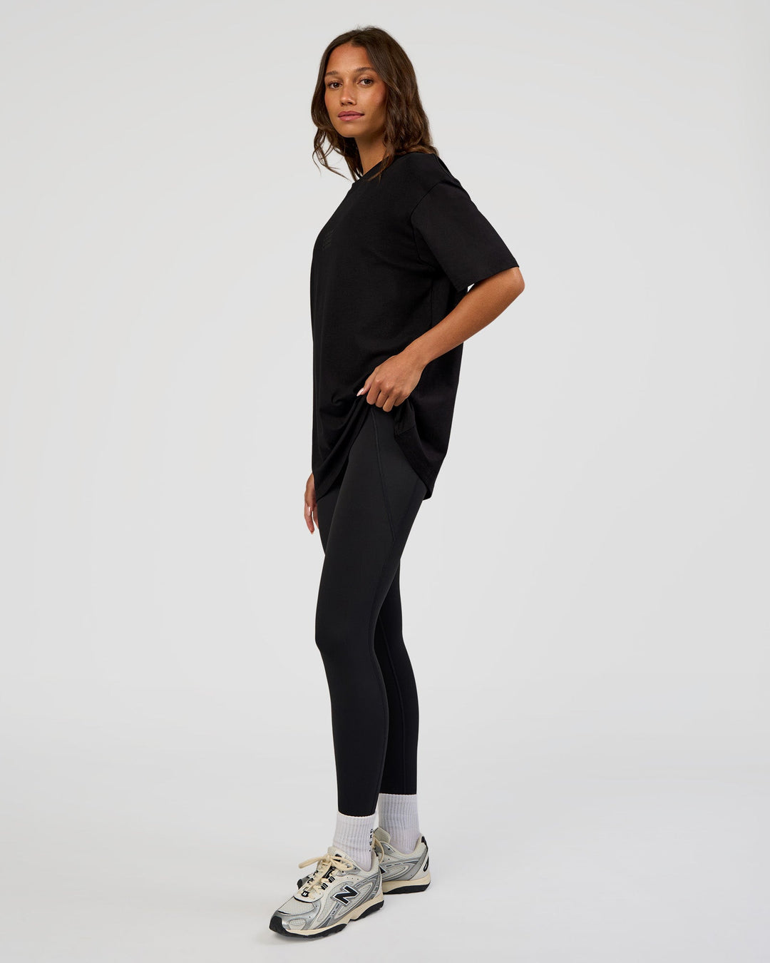Woman wearing Everyday Elevation FLXCotton Oversized Tee - Black-Black | Model:Dakota | Size:XS