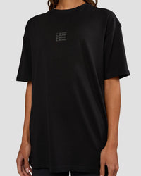 Woman wearing Everyday Elevation FLXCotton Oversized Tee - Black-Black | Model:Dakota | Size:XS