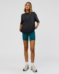 Woman wearing Everyday Elevation FLXCotton Oversized Tee - Black Washed-Carbon Green | Model:Leilani | Size:XS
