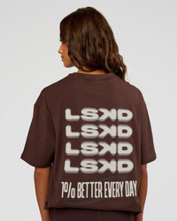 Woman wearing Everyday Elevation FLXCotton Oversized Tee - Hot Chocolate-Off White | Model:Dakota | Size:XS