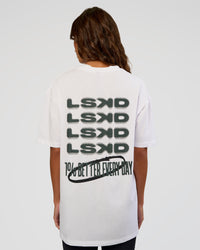 Woman wearing Everyday Elevation FLXCotton Oversized Tee - White-Carbon Green | Model:Dakota | Size:XS