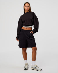 Woman wearing Everyday Elevation Waffle Oversized Sweater - Black | Model:Brylee | Size:XS