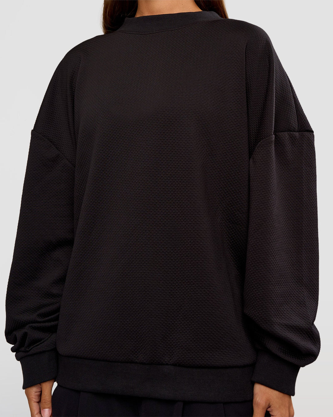 Woman wearing Everyday Elevation Waffle Oversized Sweater - Black | Model:Brylee | Size:XS