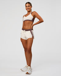 Woman wearing Force Sports Bra - Cocoa Powder-Off White | Model:Charli | Size:XS