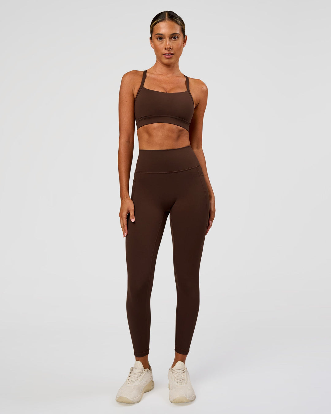 Woman wearing Fusion Ultra High-Rise 7/8 Legging Pockets - Hot Chocolate | Model:Charli | Size:XS