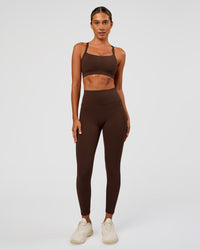 Woman wearing Fusion Ultra High-Rise 7/8 Legging Pockets - Hot Chocolate | Model:Charli | Size:XS