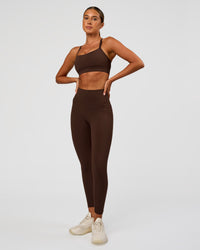 Woman wearing Fusion Ultra High-Rise 7/8 Legging Pockets - Hot Chocolate | Model:Charli | Size:XS