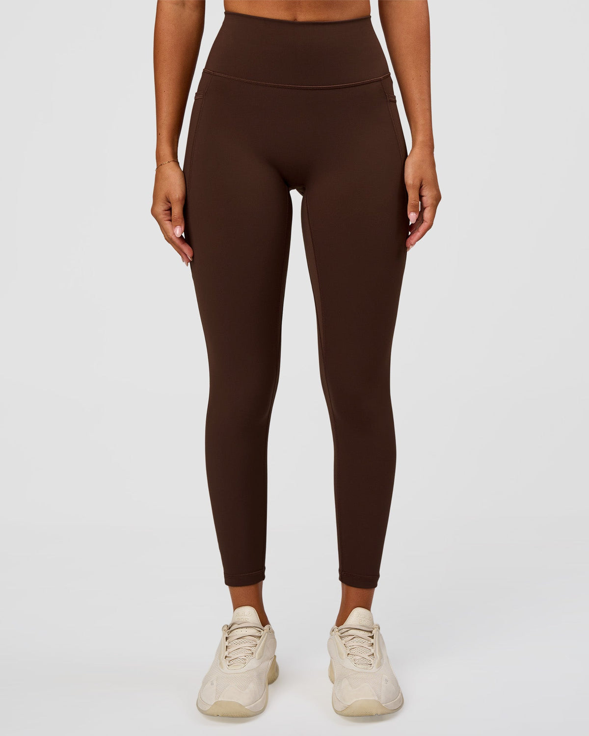 Woman wearing Fusion Ultra High-Rise 7/8 Legging Pockets - Hot Chocolate | Model:Charli | Size:XS - view 1