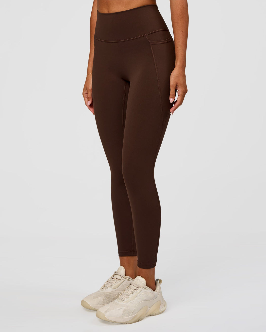 Woman wearing Fusion Ultra High-Rise 7/8 Legging Pockets - Hot Chocolate | Model:Charli | Size:XS
