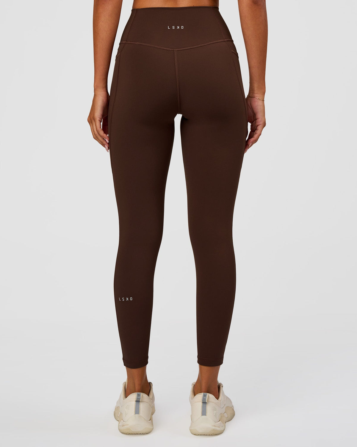 Woman wearing Fusion Ultra High-Rise 7/8 Legging Pockets - Hot Chocolate | Model:Charli | Size:XS - view 2