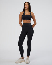 Woman wearing Fusion Ultra High-Rise Full Length Legging - Black | Model:Eliza | Size:XS