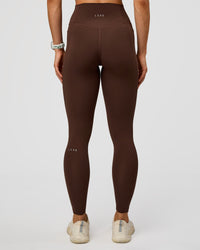 Woman wearing Fusion Ultra High-Rise Full Length Legging Pockets - Hot Chocolate | Model:Maja | Size:XS