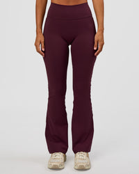 Woman wearing Fusion V-Contour High-Rise Flared Petite Legging Pockets - Cherry Lacquer | Model:Brylee | Size:XS | Thumbnail Index: 10
