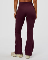 Woman wearing Fusion V-Contour High-Rise Flared Petite Legging Pockets - Cherry Lacquer | Model:Brylee | Size:XS | Thumbnail Index: 5