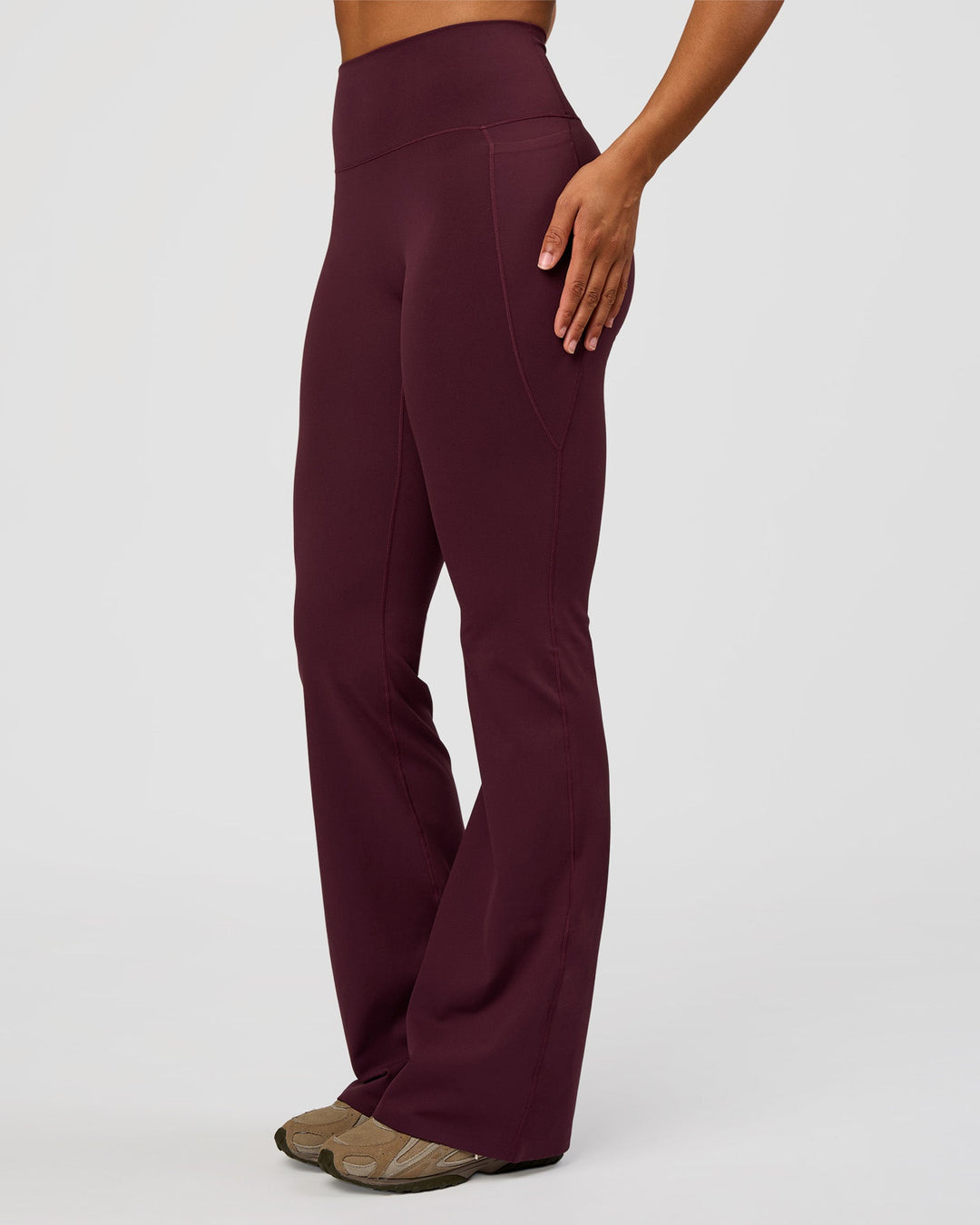 Woman wearing Fusion V-Contour High-Rise Flared Tall Legging Pockets - Cherry Lacquer | Model:Rosie | Size:S