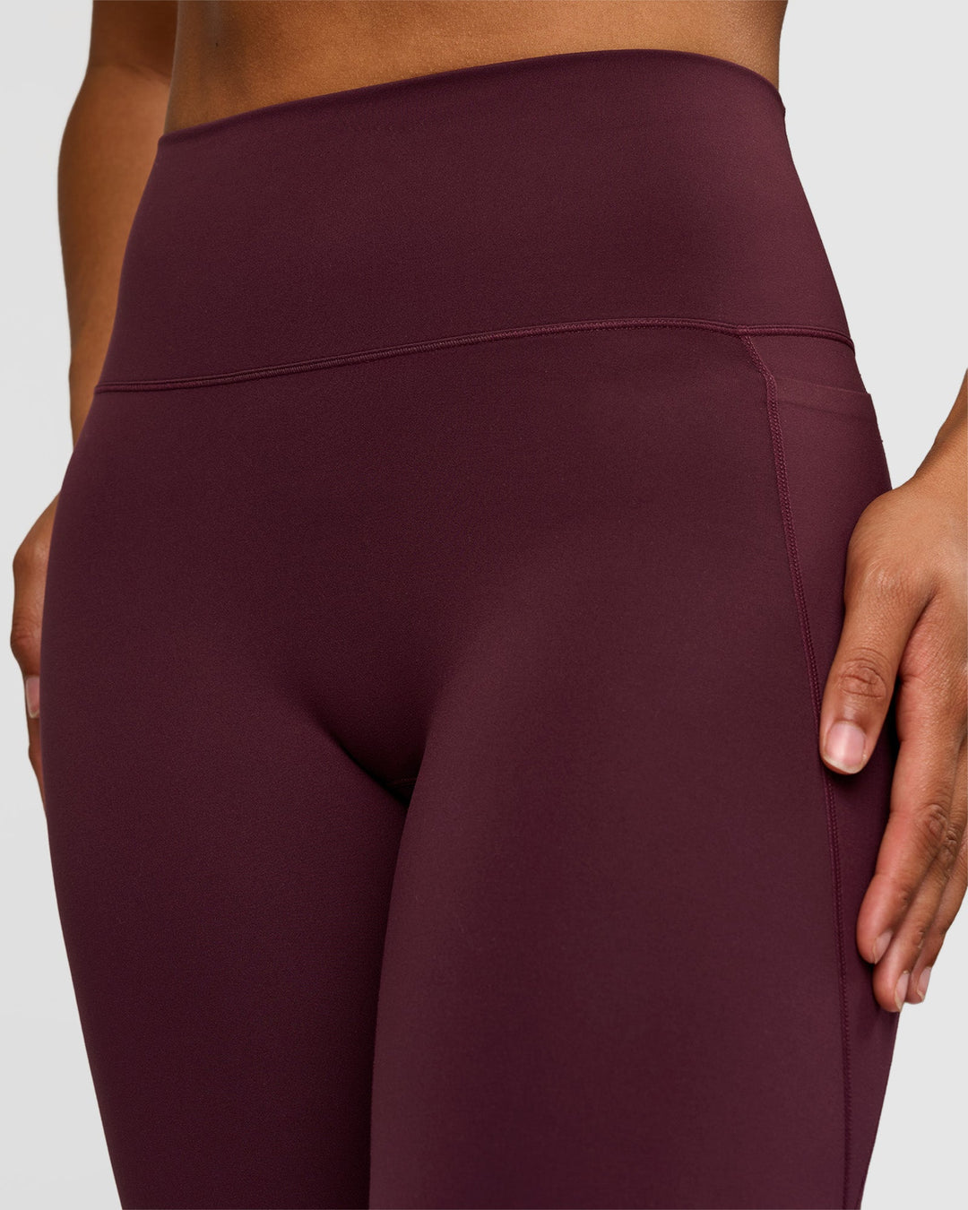 Woman wearing Fusion V-Contour High-Rise Flared Tall Legging Pockets - Cherry Lacquer | Model:Rosie | Size:S - view 3