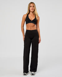 Woman wearing Fusion V-Contour High-Rise Petite Pant - Black | Model:Issy | Size:XS