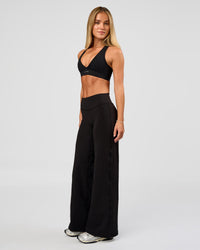Woman wearing Fusion V-Contour High-Rise Petite Pant - Black | Model:Issy | Size:XS