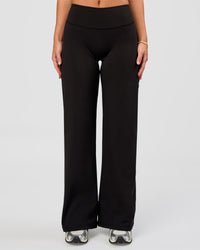 Woman wearing Fusion V-Contour High-Rise Petite Pant - Black | Model:Issy | Size:XS