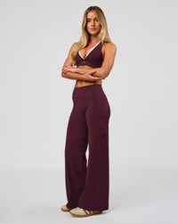 Woman wearing Fusion V-Contour High-Rise Petite Pant - Cherry Lacquer | Model:Issy | Size:XS