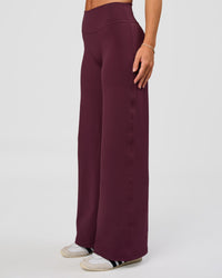 Woman wearing Fusion V-Contour High-Rise Petite Pant - Cherry Lacquer | Model:Issy | Size:XS