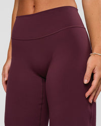 Woman wearing Fusion V-Contour High-Rise Petite Pant - Cherry Lacquer | Model:Issy | Size:XS