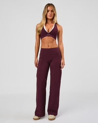 Woman wearing Fusion V-Contour High-Rise Petite Pant - Cherry Lacquer | Model:Issy | Size:XS