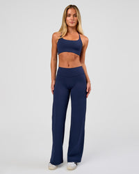 Model wearing Fusion V-Contour High-Rise Petite Pant - Future Navy | Model:Issy | Size:XS
