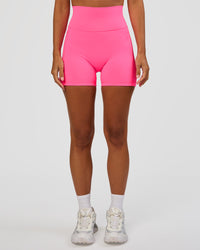 Woman wearing Fusion V-Contour Ultra High-Rise 4” Short Pockets - Sugar Plum | Model:Brylee | Size:XS