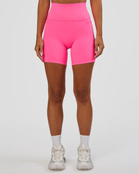 Woman wearing Fusion V-Contour Ultra High-Rise 6" Short Pockets - Sugar Plum | Model:Brylee | Size:XS