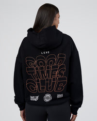 Woman wearing GTC CVC Fleece Unisex Oversized Hoodie - Black-Cantaloupe | Model:Rhiley | Size:XS