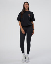 Woman wearing GTC Heavyweight Oversized Tee - Black-Cantaloupe | Model:Rhiley | Size:XS