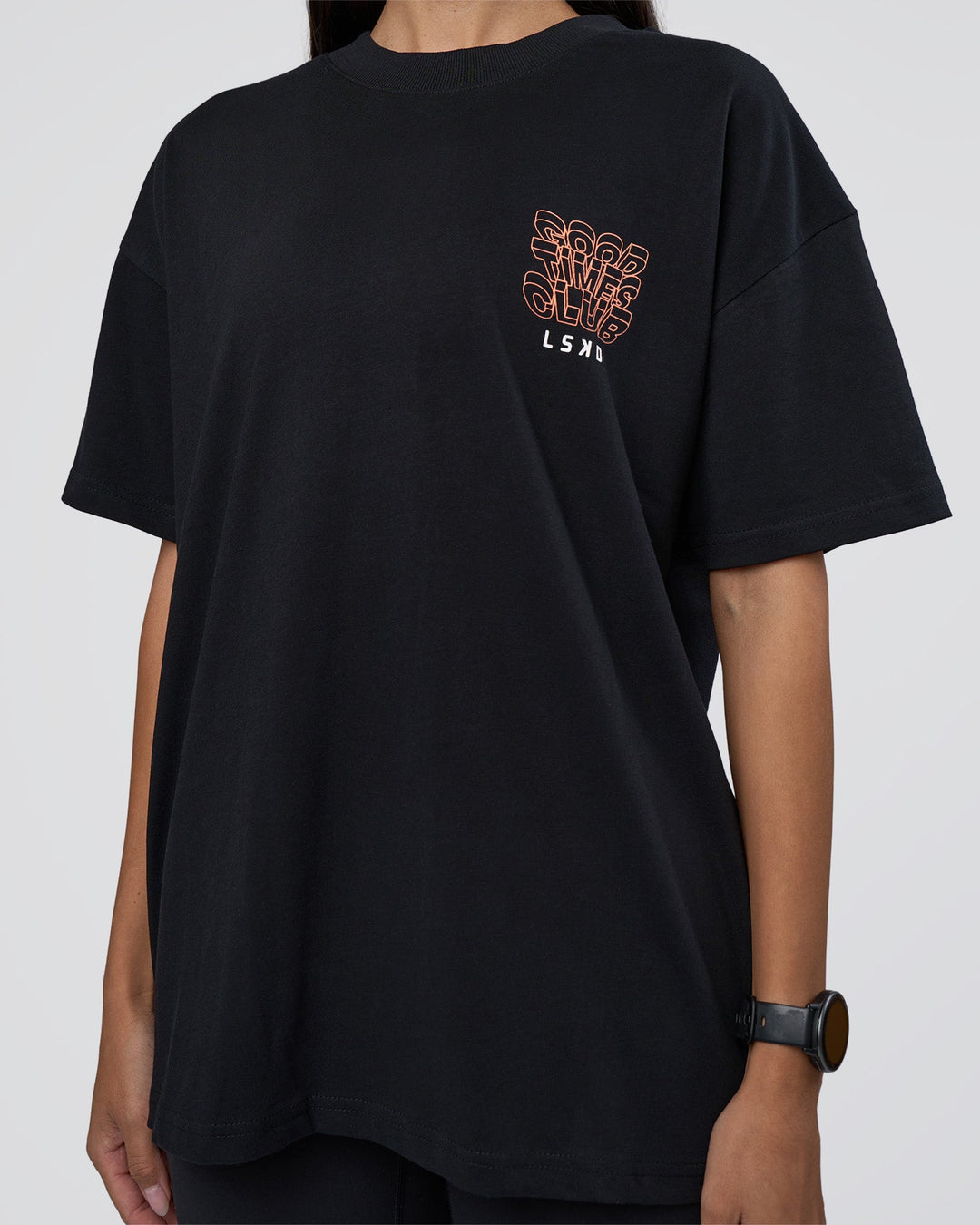 Woman wearing GTC Heavyweight Oversized Tee - Black-Cantaloupe | Model:Rhiley | Size:XS