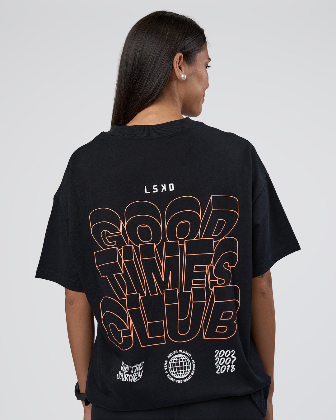 Woman wearing GTC Heavyweight Oversized Tee - Black-Cantaloupe | Model:Rhiley | Size:XS