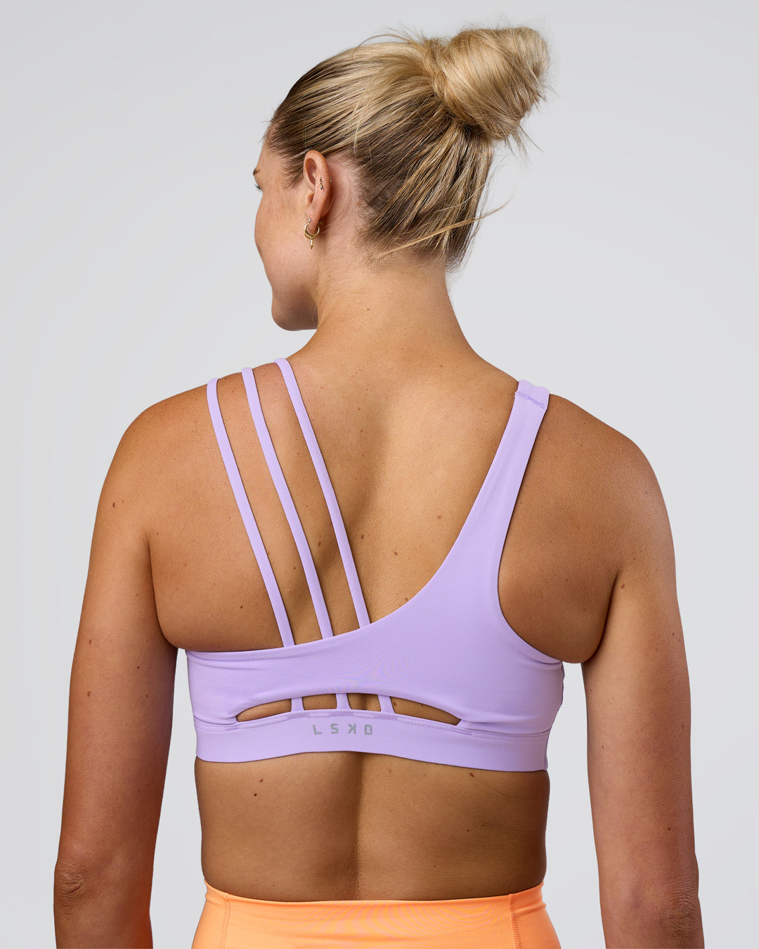 Woman wearing Galvanise Splice Sports Bra - Pale Lilac | Model:Emelia | Size:XS