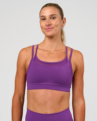 Woman wearing Genesis Layered Sports Bra - Fresh Purple | Model:Emelia | Size:XS