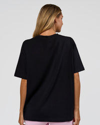Woman wearing Go-To 1% Better Every Day FLXCotton Oversized Tee - Black-White | Model:Amity | Size:XS