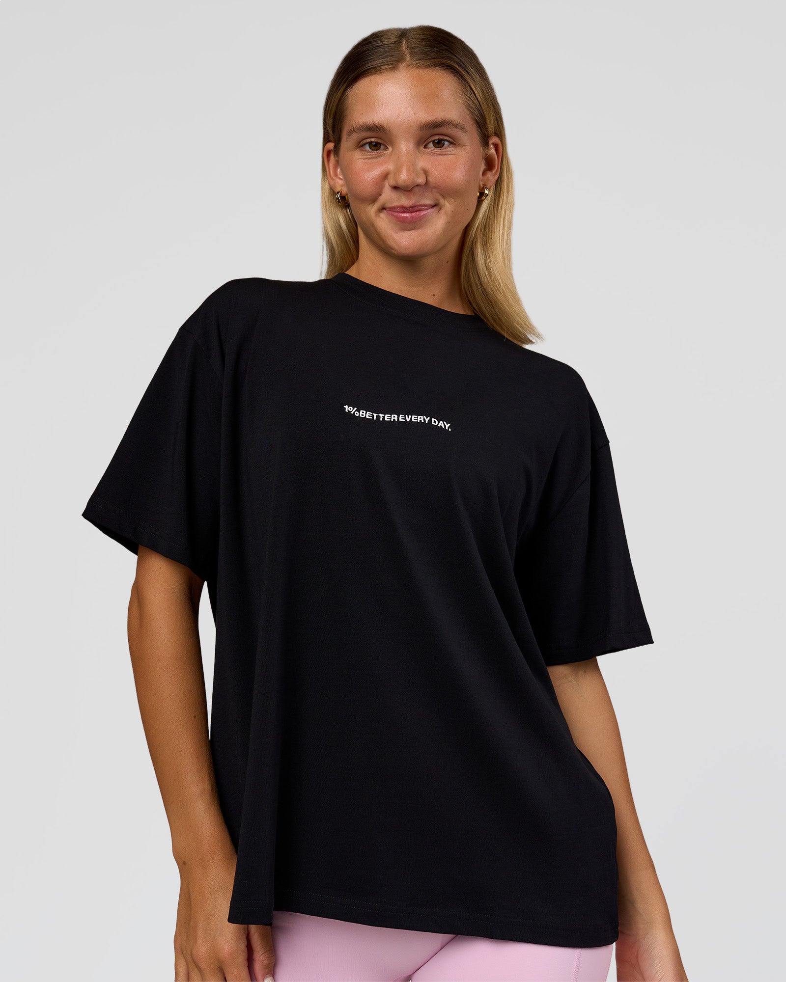 Woman wearing Go-To 1% Better Every Day FLXCotton Oversized Tee - Black-White | Model:Amity | Size:XS