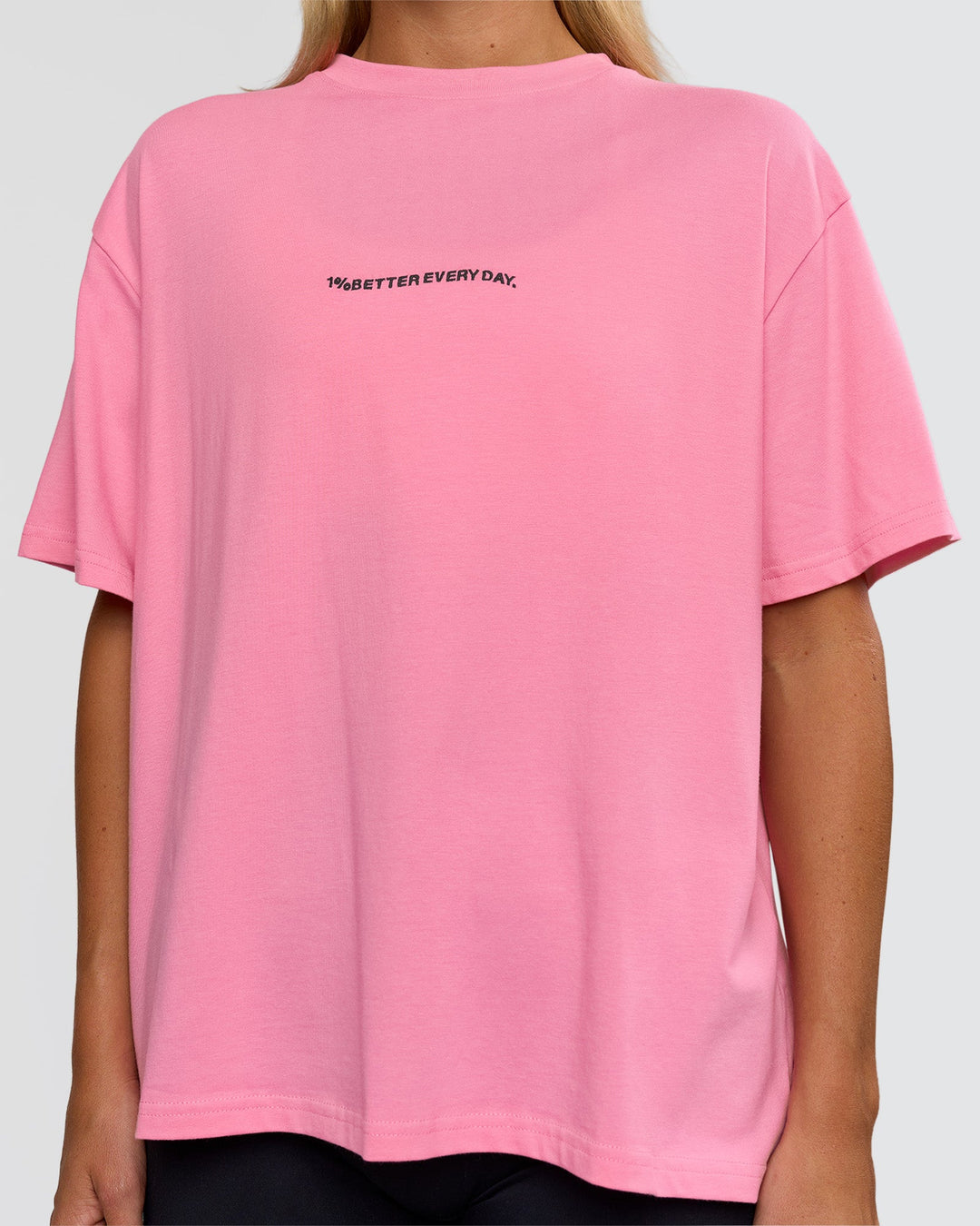 Woman wearing Go-To 1% Better Every Day FLXCotton Oversized Tee - Candy Pink-Black | Model:Amity | Size:XS