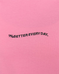Woman wearing Go-To 1% Better Every Day FLXCotton Oversized Tee - Candy Pink-Black | Model:Amity | Size:XS