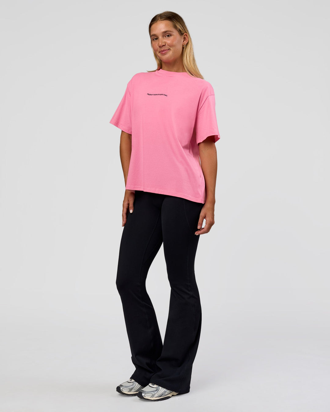Woman wearing Go-To 1% Better Every Day FLXCotton Oversized Tee - Candy Pink-Black | Model:Amity | Size:XS