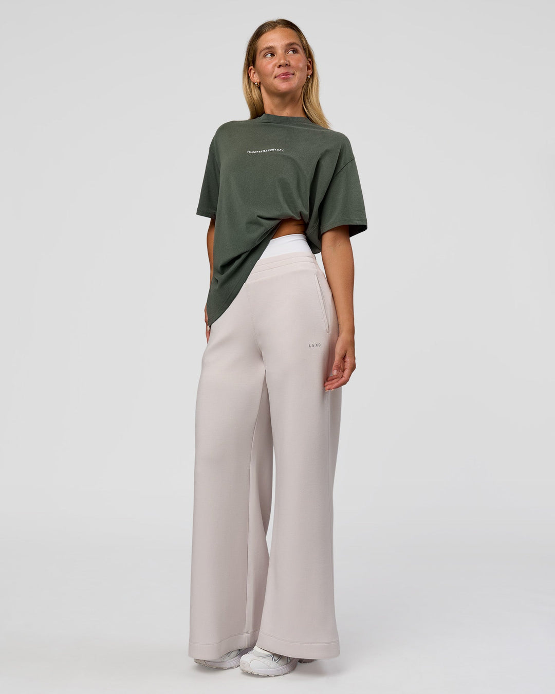 Woman wearing Go-To 1% Better Every Day FLXCotton Oversized Tee - Carbon Green Washed-White | Model:Amity | Size:XS