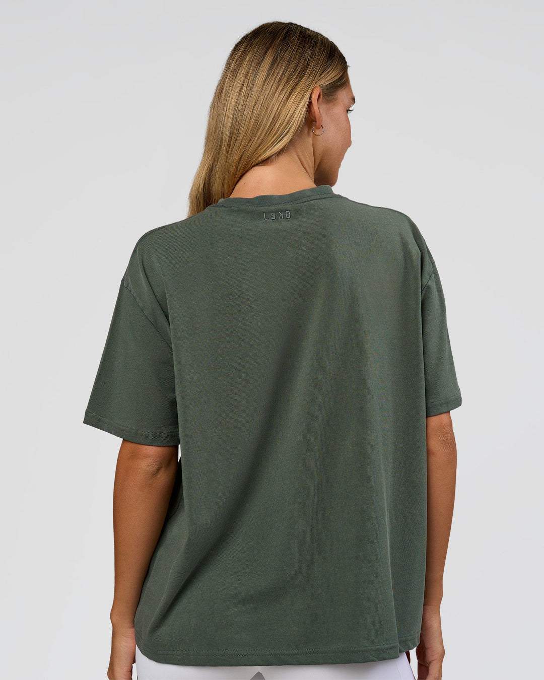 Woman wearing Go-To 1% Better Every Day FLXCotton Oversized Tee - Carbon Green Washed-White | Model:Amity | Size:XS