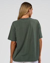 Woman wearing Go-To 1% Better Every Day FLXCotton Oversized Tee - Carbon Green Washed-White | Model:Amity | Size:XS