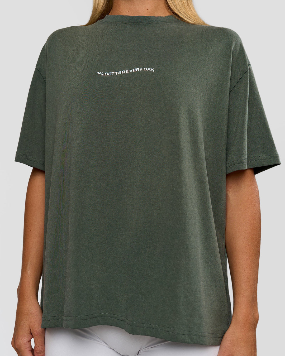 Woman wearing Go-To 1% Better Every Day FLXCotton Oversized Tee - Carbon Green Washed-White | Model:Amity | Size:XS