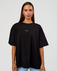 Woman wearing Go-To Break Through FLXCotton Oversized Tee - Black-Open Air | Model:Brylee | Size:XS