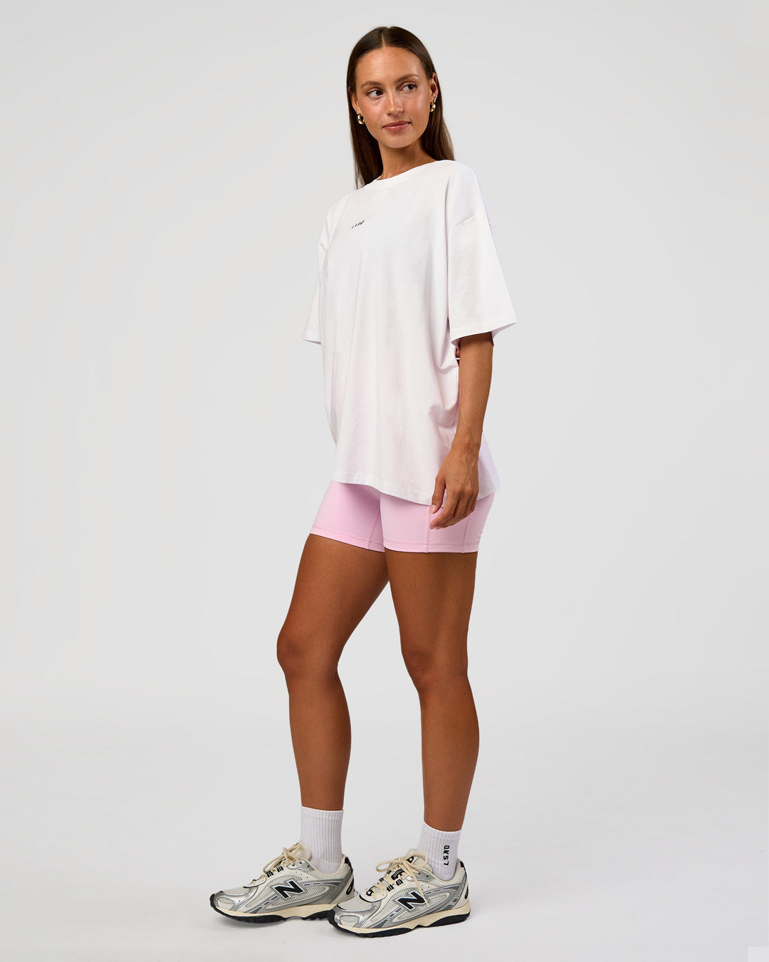 Woman wearing Go-To Break Through FLXCotton Oversized Tee - White-Marshmallow | Model:Brylee | Size:XS
