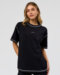 Woman wearing Go-To Contrast Oversized Heavyweight FLXCotton Tee - Black-White | Model:Leilani | Size:XS